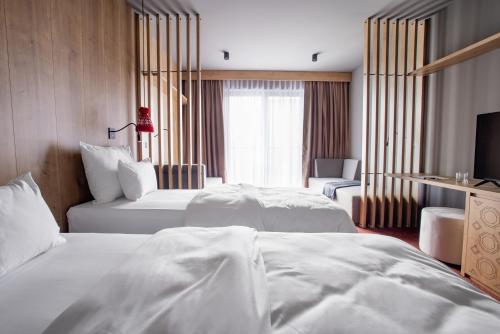 Imagen de la habitación del Hotel Nomad Wellness & Spa. Foto 18