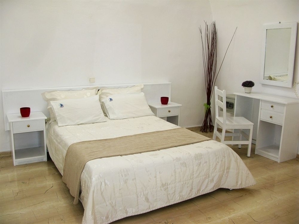 Imagen de la habitación del Hotel Nomikos Villas. Foto 3