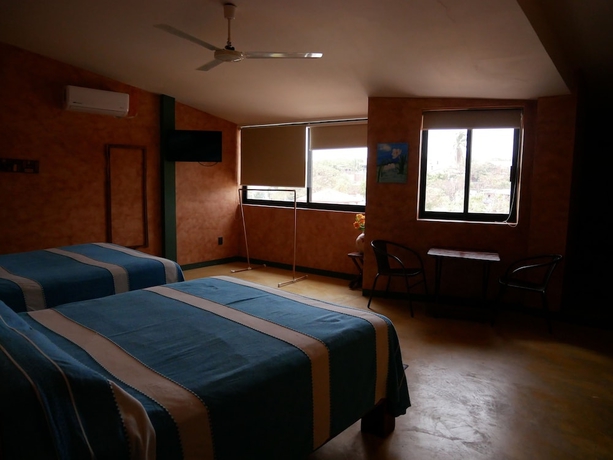 Imagen de la habitación del Hotel Nopalero Suites Hostel. Foto 10
