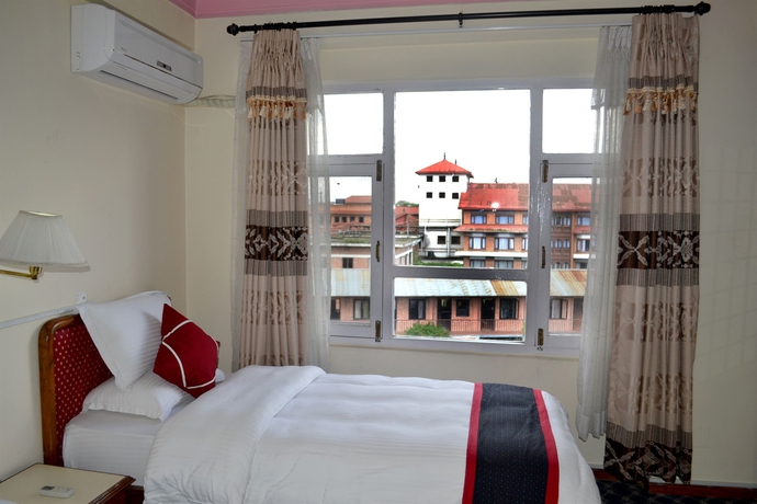 Imagen de la habitación del Hotel Norbulinka Boutique. Foto 7
