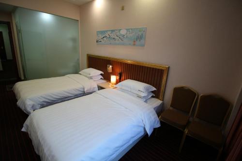 Imagen de la habitación del Hotel Nostalgic Coffee Inn Jiayuguan. Foto 5