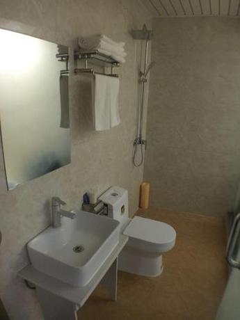 Imagen de la habitación del Hotel Nostalgic Coffee Inn Jiayuguan. Foto 7