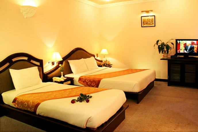Imagen de la habitación del Hotel Nouveau Happy Inn. Foto 12