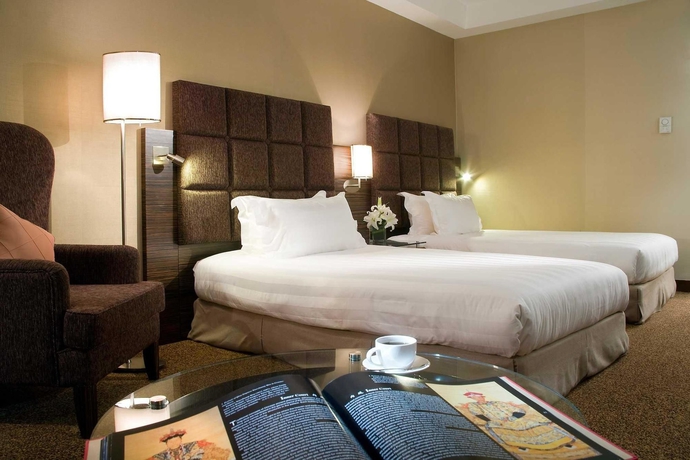 Imagen de la habitación del Hotel Novotel Beijing Peace. Foto 8