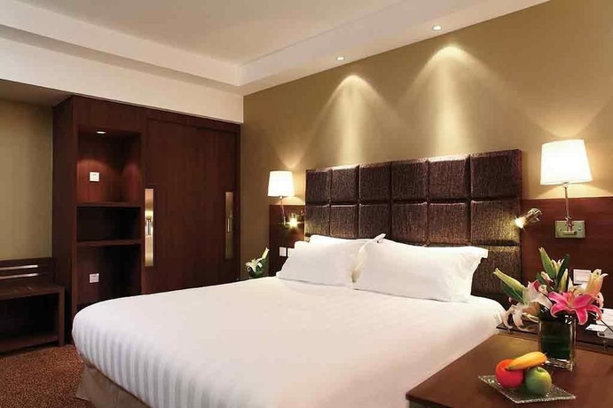 Imagen de la habitación del Hotel Novotel Beijing Peace. Foto 9