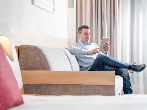 Imagen de la habitación del Hotel Novotel Brussels Off Grand Place. Foto 12