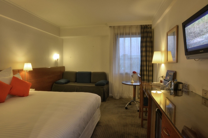 Imagen de la habitación del Hotel Novotel Cairo Airport. Foto 9