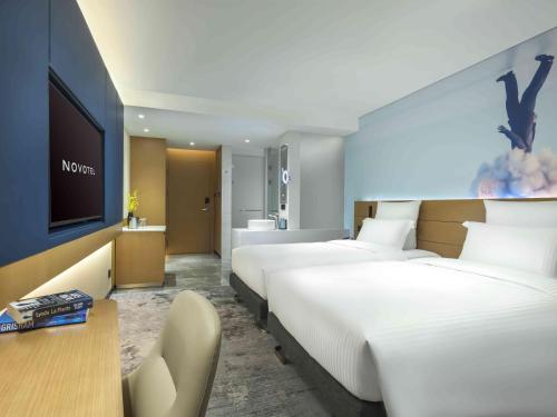 Imagen de la habitación del Hotel Novotel Guangzhou Baiyun Airport. Foto 13