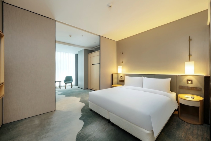 Imagen de la habitación del Hotel Novotel Haikou West Coast. Foto 11