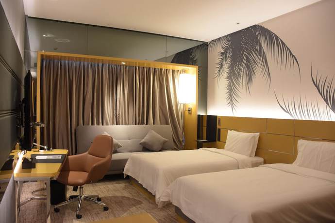 Imagen de la habitación del Hotel Novotel Haikou Xinbudao. Foto 8