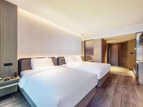 Imagen de la habitación del Hotel Novotel Kunming City Center. Foto 17
