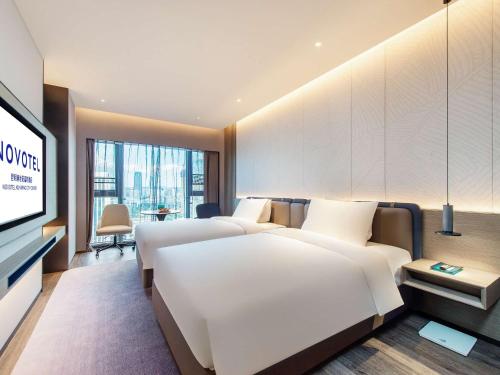 Imagen de la habitación del Hotel Novotel Kunming City Center. Foto 18