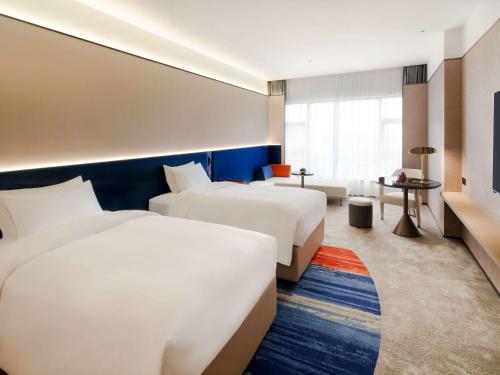 Imagen de la habitación del Hotel Novotel Nanjing Airport. Foto 13