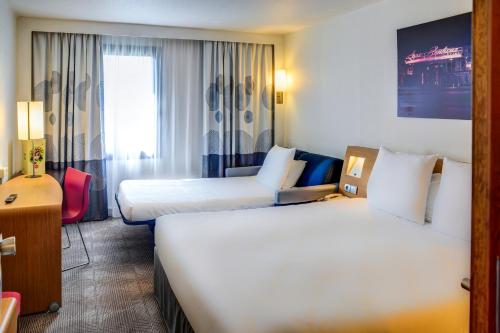 Imagen de la habitación del Hotel Novotel Paris Suresnes Longchamp. Foto 6