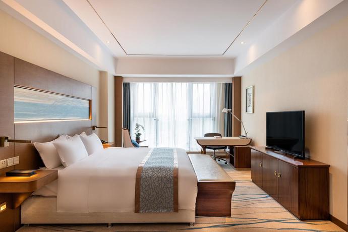 Imagen de la habitación del Hotel Novotel Qingdao New Hope. Foto 12