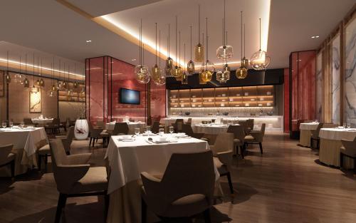 Imagen de la habitación del Hotel Novotel Rizhao Suning. Foto 10