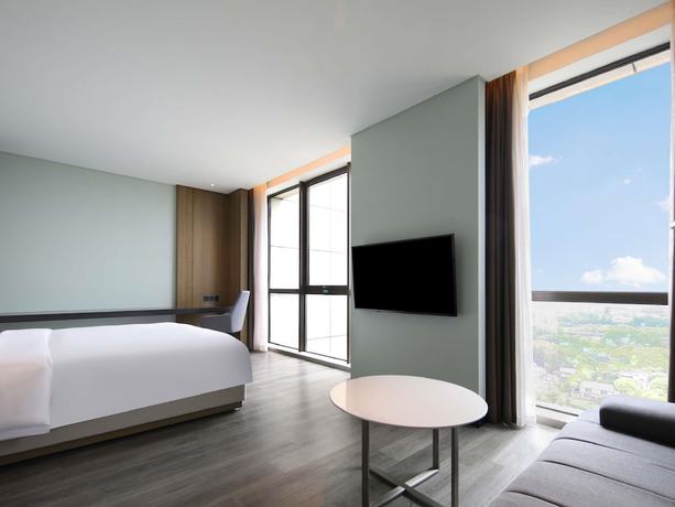 Imagen de la habitación del Hotel Novotel Shanghai Chuansha. Foto 12