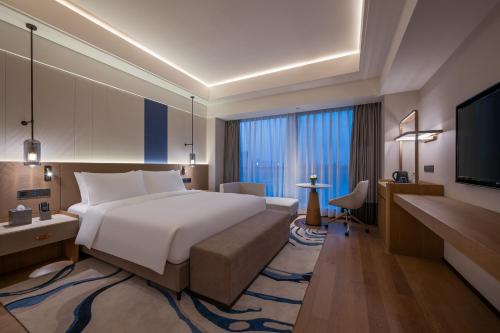Imagen de la habitación del Hotel Novotel Shanghai Jingan. Foto 4