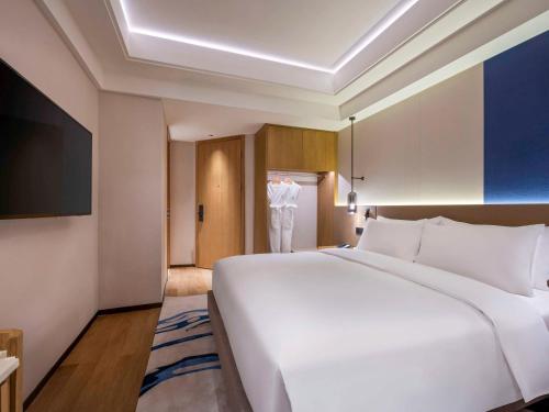Imagen de la habitación del Hotel Novotel Shanghai Jingan. Foto 7