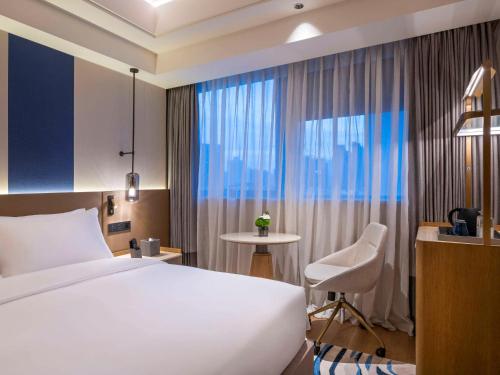 Imagen de la habitación del Hotel Novotel Shanghai Jingan, Shanghai. Foto 6