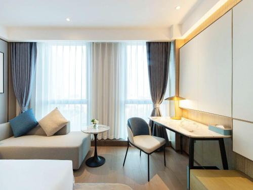 Imagen de la habitación del Hotel Novotel Suzhou Huanxiu Lake. Foto 12
