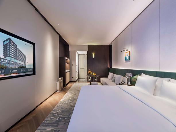 Imagen de la habitación del Hotel Novotel Xian Xixian. Foto 15