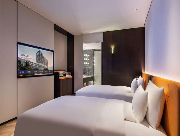 Imagen de la habitación del Hotel Novotel Xian Xixian. Foto 16