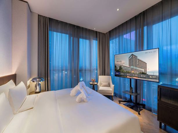 Imagen de la habitación del Hotel Novotel Xian Xixian. Foto 17