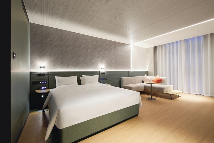 Imagen de la habitación del Hotel Novotel Yinchuan Lanxigu. Foto 8
