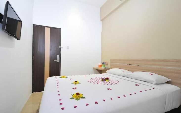 Imagen de la habitación del Hotel Nozz Semarang. Foto 18