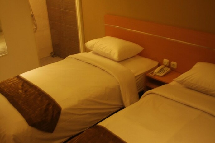 Imagen de la habitación del Hotel Nozz Semarang. Foto 20