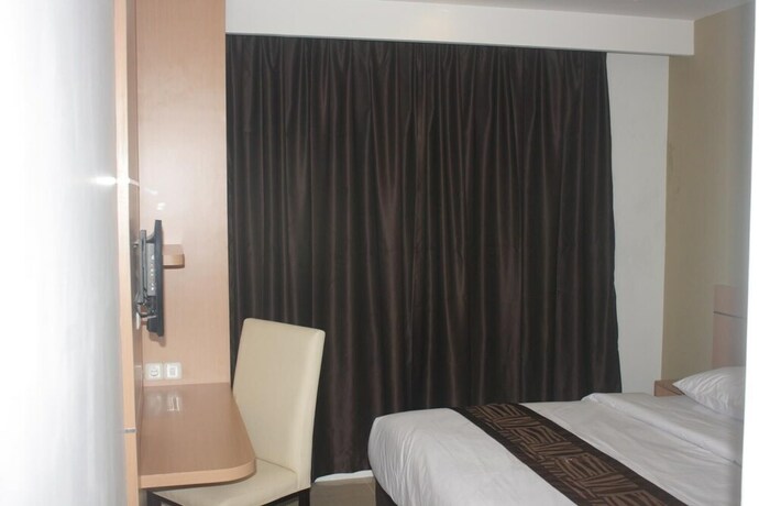 Imagen de la habitación del Hotel Nozz Semarang. Foto 24