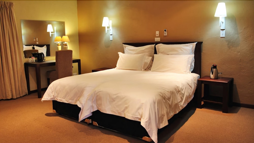 Imagen de la habitación del Hotel Numbi and Garden Suites. Foto 13