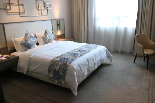 Imagen de la habitación del Hotel Nuohuating. Foto 5