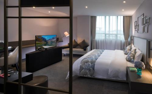 Imagen de la habitación del Hotel Nuohuating. Foto 6