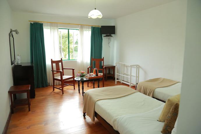 Imagen de la habitación del Hotel Nuwara Eliya Golf Club. Foto 13