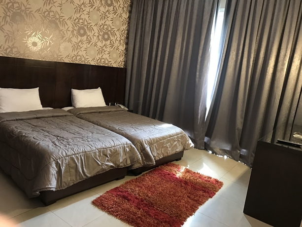 Imagen de la habitación del Hotel Ny Suites. Foto 12