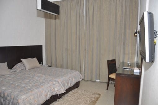 Imagen de la habitación del Hotel Ny Suites. Foto 15