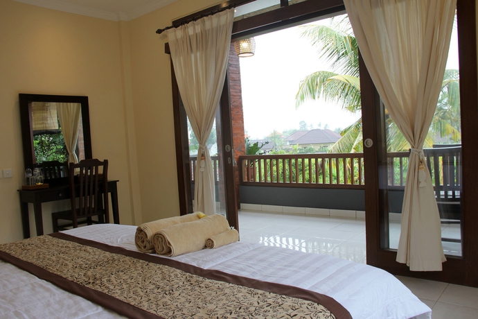 Imagen de la habitación del Hotel Nyoman Sandi Guest House. Foto 6
