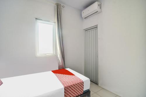 Imagen general del Hotel O 3m Kost Dan Homestay. Foto 7