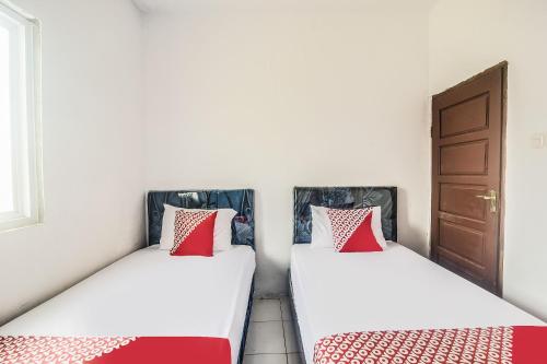 Imagen de la habitación del Hotel O 3m Kost Dan Homestay. Foto 20