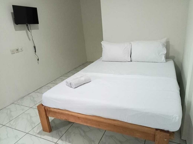 Imagen de la habitación del Hotel O 95063 Afifah Syariah Guest House Manado. Foto 4