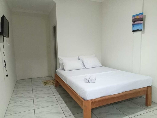 Imagen de la habitación del Hotel O 95063 Afifah Syariah Guest House Manado. Foto 5