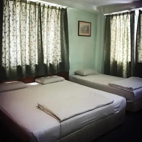 Imagen de la habitación del Hotel O Asia City. Foto 2