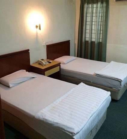 Imagen de la habitación del Hotel O Asia City. Foto 4