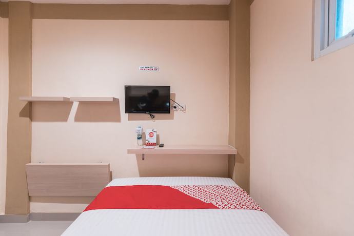 Imagen de la habitación del Hotel O Balcon Biru. Foto 14