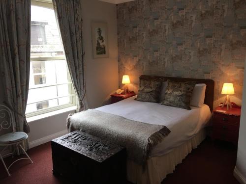 Imagen de la habitación del Hotel O Donovans. Foto 5