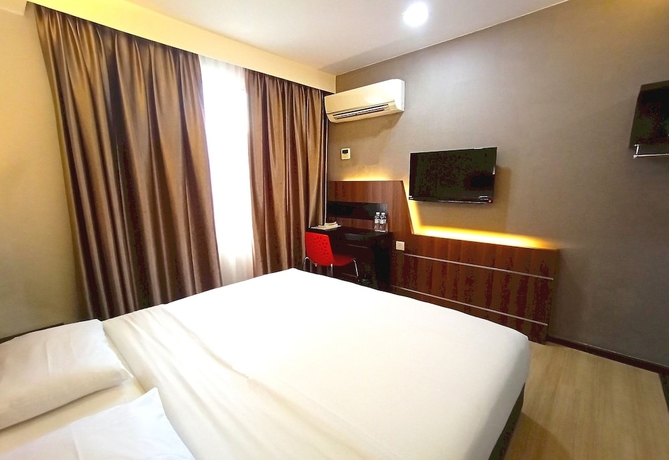 Imagen de la habitación del Hotel O Hi Inn. Foto 3