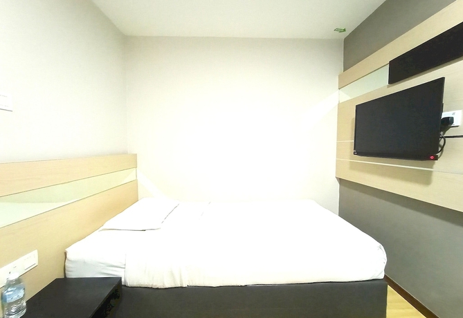 Imagen de la habitación del Hotel O Hi Inn. Foto 4