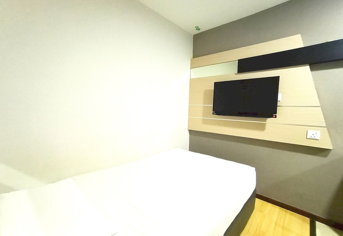 Imagen de la habitación del Hotel O Hi Inn. Foto 5